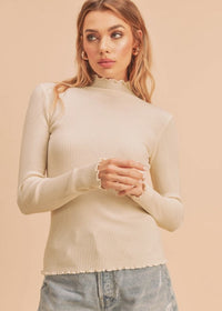 MOCK NECK LETTUCE HEM SWEATER